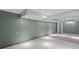 Spacious basement featuring neutral paint, recessed lighting, and tile flooring offers plenty of room for activities at 2134 N Alabama St, Indianapolis, IN 46202