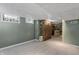 Finished basement area with a partial stone wall and a bar area at 2134 N Alabama St, Indianapolis, IN 46202