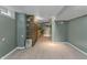Open basement area with stone accent wall and a partial bar area at 2134 N Alabama St, Indianapolis, IN 46202