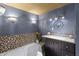 Luxury bathroom with a jetted tub, granite counters, and dark wood cabinets offers a relaxing retreat at 2134 N Alabama St, Indianapolis, IN 46202