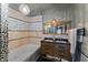 Elegant bathroom with a jacuzzi tub, a double sink vanity, and bright lighting at 2134 N Alabama St, Indianapolis, IN 46202