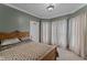 Comfortable bedroom featuring paneled walls, textured ceiling, and bright natural light at 2134 N Alabama St, Indianapolis, IN 46202