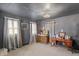 Serene bedroom with natural light, vintage furniture, and ample display space at 2134 N Alabama St, Indianapolis, IN 46202
