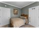 Cozy bedroom with two closets, neutral walls and carpet, and bright natural light at 2134 N Alabama St, Indianapolis, IN 46202