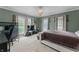 Large bedroom with ample natural light, textured ceiling, neutral carpet and walls at 2134 N Alabama St, Indianapolis, IN 46202