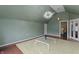 Large bedroom featuring wood floors, light fixture, and a window with white trim at 2134 N Alabama St, Indianapolis, IN 46202