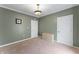 Comfortable bedroom featuring textured ceiling, paneled walls, neutral carpet, and two closets at 2134 N Alabama St, Indianapolis, IN 46202
