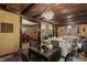 Elegant dining space flows into living room, featuring dark wood table and ornate ceiling details at 2134 N Alabama St, Indianapolis, IN 46202