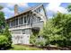 Charming home with an exterior featuring a gray facade, white trim, and mature landscaping at 2134 N Alabama St, Indianapolis, IN 46202