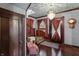 Elegant home foyer with detailed woodwork, a vintage clock, and a cozy, classic aesthetic at 2134 N Alabama St, Indianapolis, IN 46202
