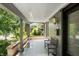 Inviting front porch features patterned tile flooring, a comfortable bench, and neighborhood views at 2134 N Alabama St, Indianapolis, IN 46202