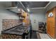 Kitchen featuring a cooking range, wooden cabinets, dark countertops and modern ventilation system at 2134 N Alabama St, Indianapolis, IN 46202