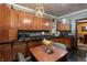 This well-equipped kitchen offers wooden cabinets, a sleek countertop, and a quaint dining area at 2134 N Alabama St, Indianapolis, IN 46202