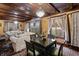 Sophisticated living space adjacent to dining, highlighted by a chandelier and comfortable seating at 2134 N Alabama St, Indianapolis, IN 46202