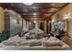 Cozy living room featuring plush seating, a decorative fireplace, and intricate ceiling details at 2134 N Alabama St, Indianapolis, IN 46202