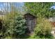 Backyard shed surrounded by lush greenery, offering a functional outdoor storage space at 2134 N Alabama St, Indianapolis, IN 46202