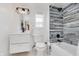Modern bathroom featuring a sleek vanity, updated fixtures, and stylish tile in the shower area at 2230 Pleasant St, Indianapolis, IN 46203