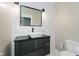 Bathroom vanity with a vessel sink and updated lighting at 2230 Pleasant St, Indianapolis, IN 46203