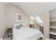 Charming bedroom featuring a sloped ceiling, skylight, and tasteful decor at 2230 Pleasant St, Indianapolis, IN 46203
