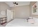 Cozy bedroom featuring a large bed, stylish decor, and a glimpse into an adjacent room at 2230 Pleasant St, Indianapolis, IN 46203