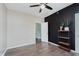 Bedroom with a ceiling fan, a plant, and a door at 2230 Pleasant St, Indianapolis, IN 46203