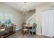 Cozy dining area with stylish lighting, updated decor, and wood laminate flooring at 2230 Pleasant St, Indianapolis, IN 46203
