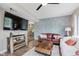 Cozy living room featuring wood floors, modern paneling and updated furnishings at 2230 Pleasant St, Indianapolis, IN 46203
