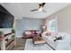 Cozy living room featuring wood floors, modern paneling and updated furnishings at 2230 Pleasant St, Indianapolis, IN 46203