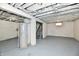 Large unfinished basement with water heater, painted walls, and exposed ceiling at 2966 N Olney St, Indianapolis, IN 46218