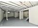 Spacious unfinished basement with painted walls, exposed ceiling, and access to stairs at 2966 N Olney St, Indianapolis, IN 46218