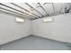 Unfinished basement space with concrete walls, exposed ceiling, and small windows at 2966 N Olney St, Indianapolis, IN 46218