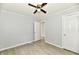 Bedroom featuring gray walls, modern ceiling fan, and wood-look flooring at 2966 N Olney St, Indianapolis, IN 46218