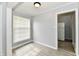 Cozy dining room with gray walls, wood-look flooring, and a view into the kitchen at 2966 N Olney St, Indianapolis, IN 46218