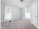 Bedroom with neutral carpet, and natural light, with a large closet door at 31 N Bolton Ave, Indianapolis, IN 46219