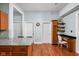 Kitchen area featuring granite countertops, wood cabinets, and desk area at 31 N Bolton Ave, Indianapolis, IN 46219