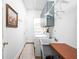 Laundry room featuring washer, dryer, utility sink, and storage cabinets at 31 N Bolton Ave, Indianapolis, IN 46219