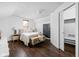 Main bedroom with wood floors, neutral walls, and closet at 31 N Bolton Ave, Indianapolis, IN 46219