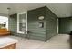 Inviting front porch showcasing a classic porch swing, with views of the neighborhood and a place to relax at 31 N Bolton Ave, Indianapolis, IN 46219