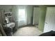 Bright bedroom features carpeted floors and a makeup vanity with a rolling chair at 3324 S Walnut St, Muncie, IN 47302