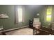 Charming Bedroom with wood floors has pink accents and plenty of natural light at 3324 S Walnut St, Muncie, IN 47302