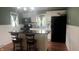 Well-lit kitchen with white cabinetry and a functional center island with seating at 3324 S Walnut St, Muncie, IN 47302