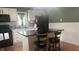 Kitchen with stainless steel appliances and breakfast bar with additional seating at 3324 S Walnut St, Muncie, IN 47302