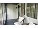 Inviting screened-in porch with comfortable seating, creating a relaxing outdoor living space at 3324 S Walnut St, Muncie, IN 47302