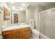 Bathroom featuring a wood vanity, shower stall, and neutral decor at 3537 Woodglen Way, Anderson, IN 46011