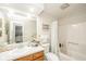 Bright bathroom with a large mirror, decorative accents, and shower-tub combo at 3537 Woodglen Way, Anderson, IN 46011