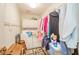 Laundry area with appliances, storage, and a drying rack, offering practical space at 3537 Woodglen Way, Anderson, IN 46011
