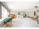 Bright and airy living room with carpeted floors, a desk, and comfortable seating arrangements at 3537 Woodglen Way, Anderson, IN 46011