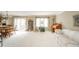 Bright living room with sliding glass doors to backyard, dining area, and lots of natural light at 3537 Woodglen Way, Anderson, IN 46011
