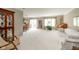 Spacious living room featuring carpet, a dining area, and lots of natural light from sliding door at 3537 Woodglen Way, Anderson, IN 46011