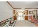 Open-concept living room with a couch and view into the kitchen at 3537 Woodglen Way, Anderson, IN 46011